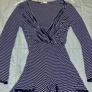 Navy and white striped romper with long sleeves and V-neck